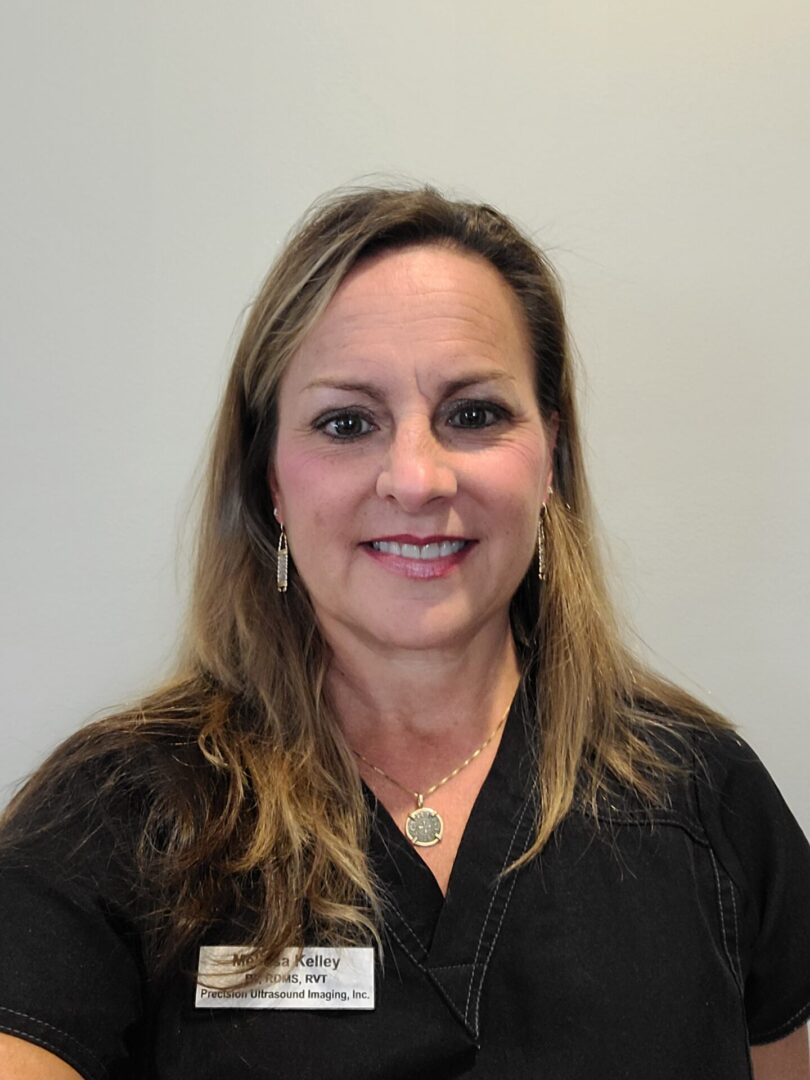 A woman with long hair wearing black shirt.